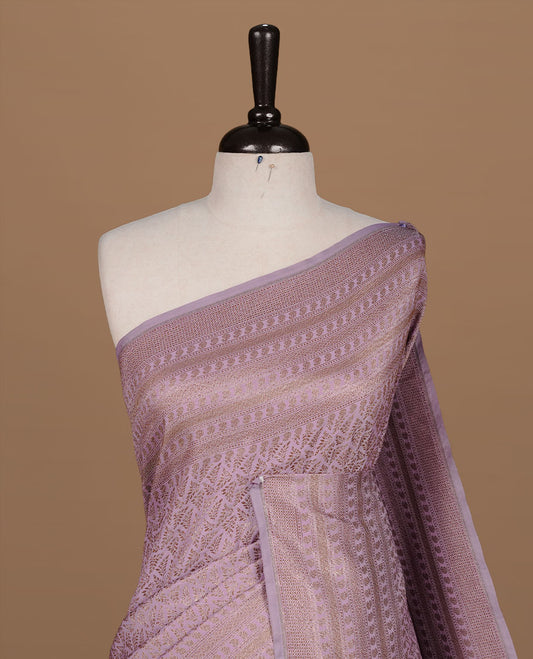 Lavender colour Semi Banaras Katan saree featuring Antique zari Floral pattern on body, complemented by self colour zari border, paired with matching blouse piece.