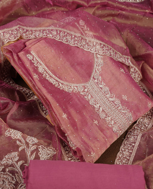 Onion pink colour churidar set with stone and thread embroidery and detailing, paired with matching pant and dupatta.