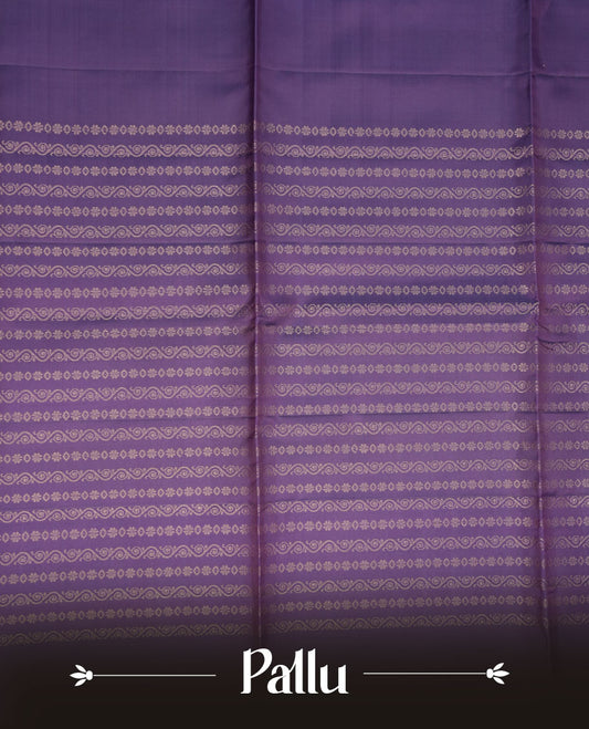 Indigo colour soft silk saree featuring gold zari motifs on body, complemented by self colour with traditional border with tassel at pallu, paired with matching blouse piece.