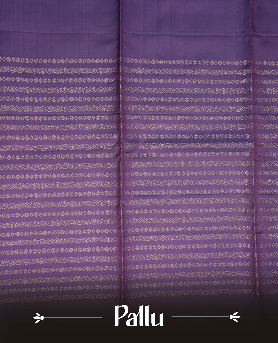 Indigo colour soft silk saree featuring gold zari motifs on body, complemented by self colour with traditional border with tassel at pallu, paired with matching blouse piece.