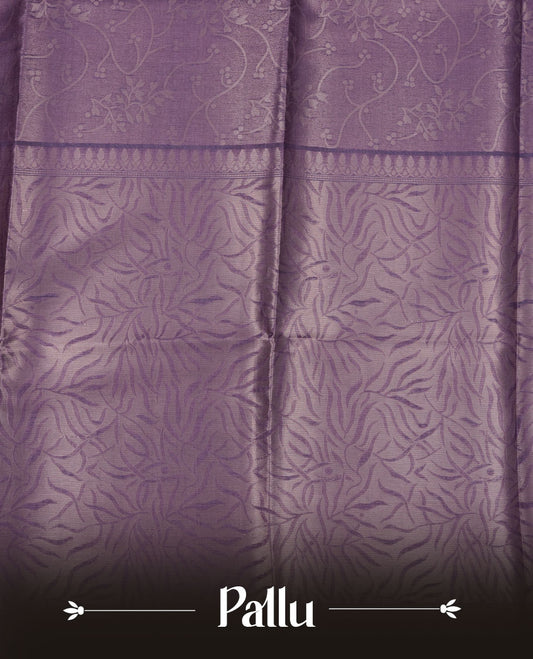 Lavender colour semi tussar silk saree, featuring an intricate gold zari floral kodi pattern on the body and pallu, comes with matching blouse.
