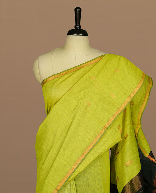 Lemon colour Mashwari cotton saree features elegant gold zari motifs across the body, a classic gold zari border, a striking contrast pallu, and a matching blouse piece.