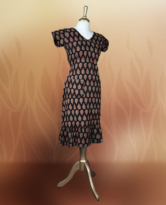 Brownish black colour nightwear with traditional block print motifs in red and beige, Features a V neck, short sleeves, and a stylish tiered flared hem, Perfect for festive events, casual wear, or cultural gatherings.