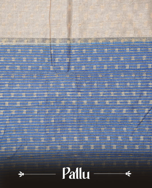 Light Gold Tussar saree featuring Gold zari buttas on body, complemented by contrast Blue Colour with Gold zari border, comes with matching blouse piece.