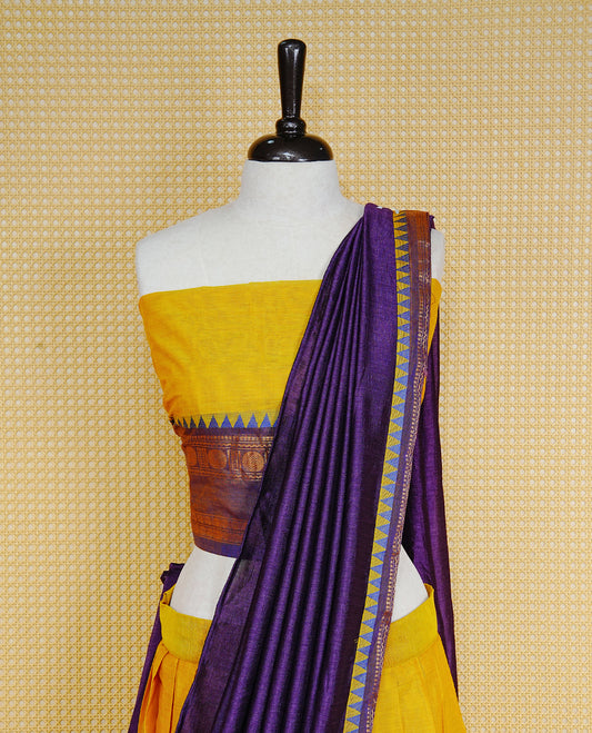 Lemon colour Semi Stitched Dhavni set Featuring Lemon Skirt With Contrast Purple colour with Zari border, paired with UnStitched Blouse & Elegant Dupatta.