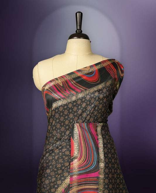 Black colour saree enhanced with a vibrant golden border and multiple colour prints pallu, adorned with intricate golden floral colour prints on the body & comes with a matching blouse.