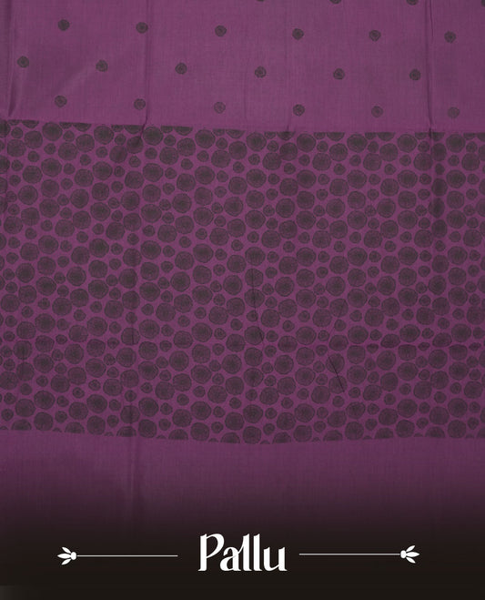 Grape Purple colour poly cotton saree with black abstract butti motifs on the body, paired with a matching pallu with dense black textured round butta pattern, and a coordinated all‑over textured round butta printed blouse piece.
