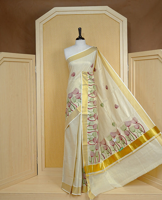 Cream colour Tissue kerala saree featuring Embroidery buttas on body, complemented by Plant thread work & kasavu kara, comes with matching blouse piece.