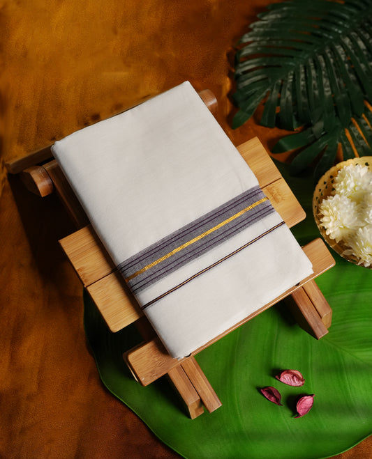 White colour cotton dhoti featuring a stylish dark purple border with golden zari highlights, blending traditional charm with modern elegance.