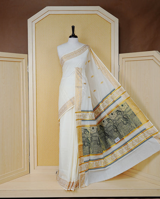 Cream Colour Cotton Kerala Saree Featuring Gold Buttas on the Body, a Classy Gold Zari Border, and a Traditional Green Colour Lord Krishna Thread work and Gold Zari Pallu, Paired with a Matching Blouse Piece.