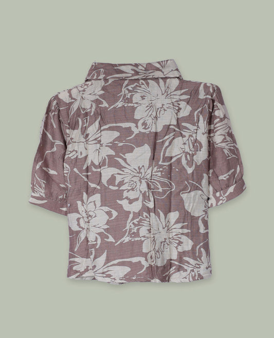 Dusty mauve floral printed shirt top with collared neckline, front button placket, short cuffed sleeves, and soft gathers at the shoulders.