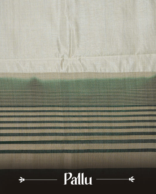 Light gold tussar saree featuring Elegant plain body, complemented by contrast Bottle green colour with Gold zari Floral kodi with Peacock Pattern border, comes with matching blouse piece.