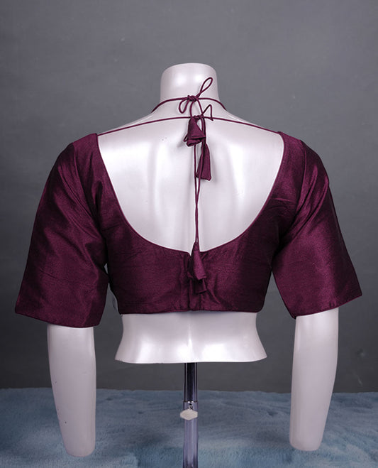 Wine colour colour silk padded readymade blouse with elbow-length sleeves, a V-neck front, and a deep U-back with tie-up dori.