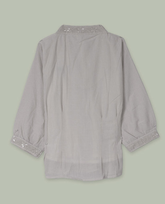 Cream three-quarter sleeve shirt top with embellished band collar and cuffs, front button placket, and soft pleating below the placket.