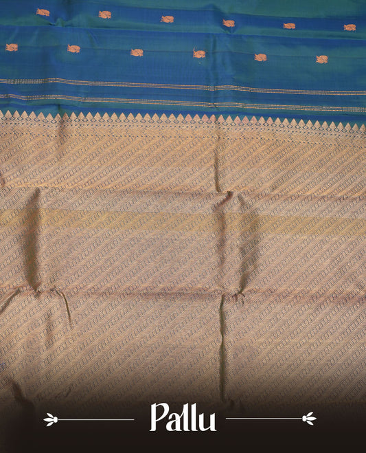 Peacock blue pure traditional Kancheepuram silk saree adorned with gold zari peacock motifs across the body, featuring elegant traditional borders with animal motifs, beautifully paired with a matching blouse piece.