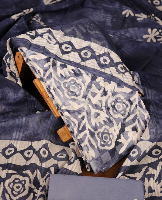 Blue colour churidar material featuring white floral printed body, paired with a matching chevron printed dupatta.