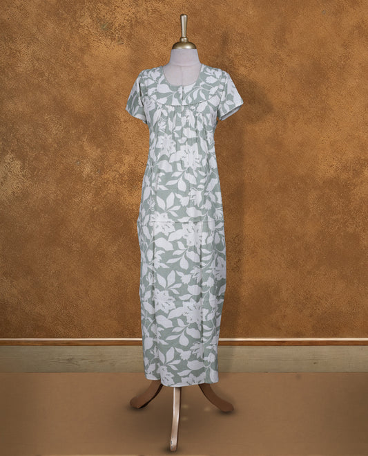 Dark sea green colour NStyle nighty featuring Offwhite Leaf patterns, a Round neckline and thread border, short sleeves, and a full ankle-length design.