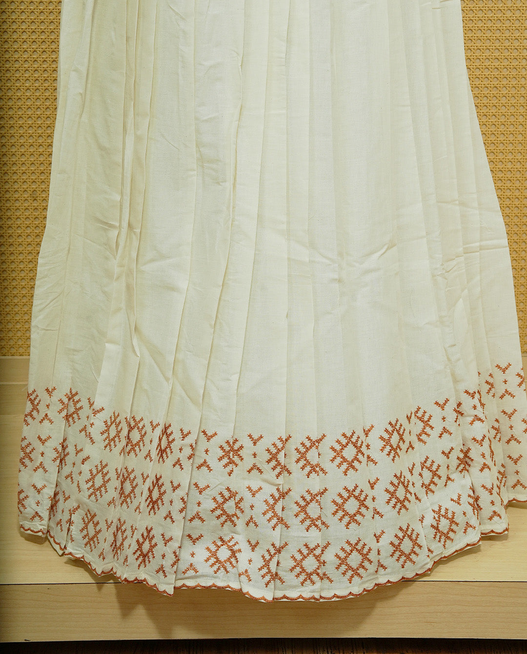 Cream colour cotton Stitched Skirt With Mustard colour thread pattern Scallop border.