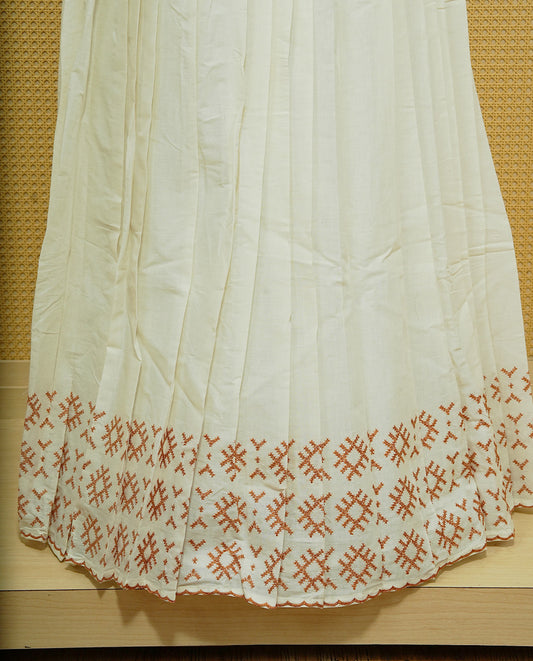 Cream colour cotton Stitched Skirt With Mustard colour thread pattern Scallop border.