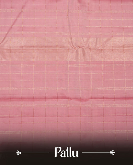 Dusty Pink colour pure traditional Kancheepuram silk saree adorned with gold zari Checks across the body, featuring simple borders, beautifully paired with a matching blouse piece.