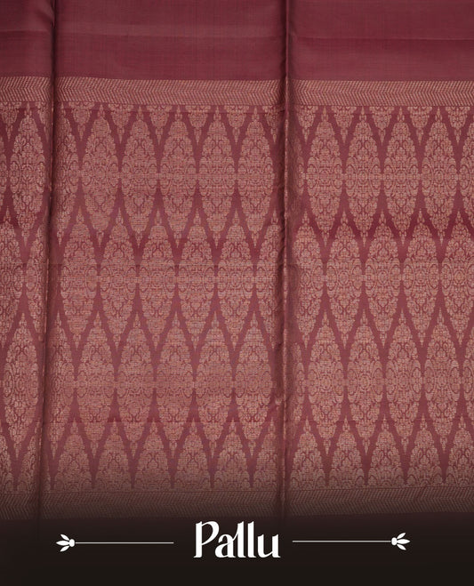 Brown colour soft silk saree featuring gold zari motifs on body, complemented by self colour with traditional border with tassel at pallu, paired with matching blouse piece.