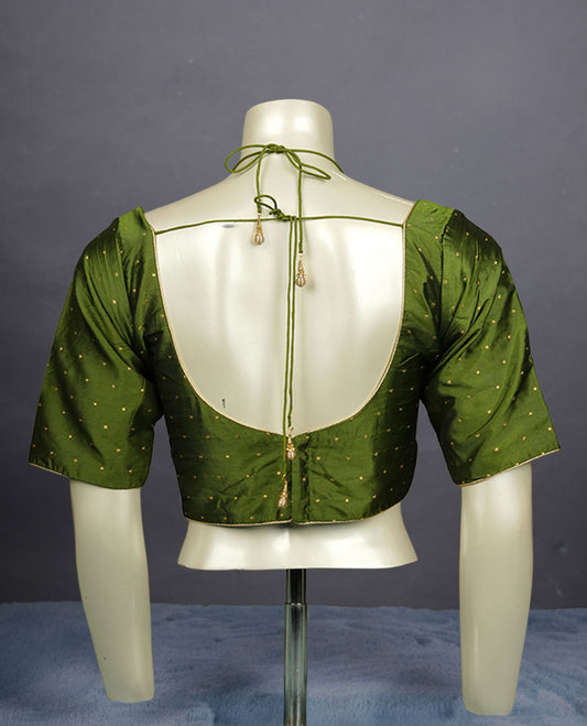 Fern Green colour padded blouse with gold polka dots, V neckline, elbow sleeves, and deep tie-up back.