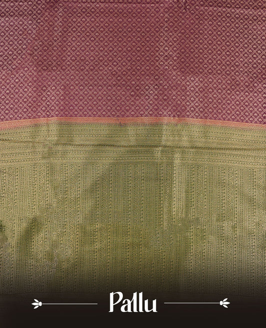 Grape Purple colour semi silk brocade saree featuring intricate Gold Floral kodi & leaf patterns across the body, complemented by a contrast green colour woven border and pallu, paired with a matching blouse.