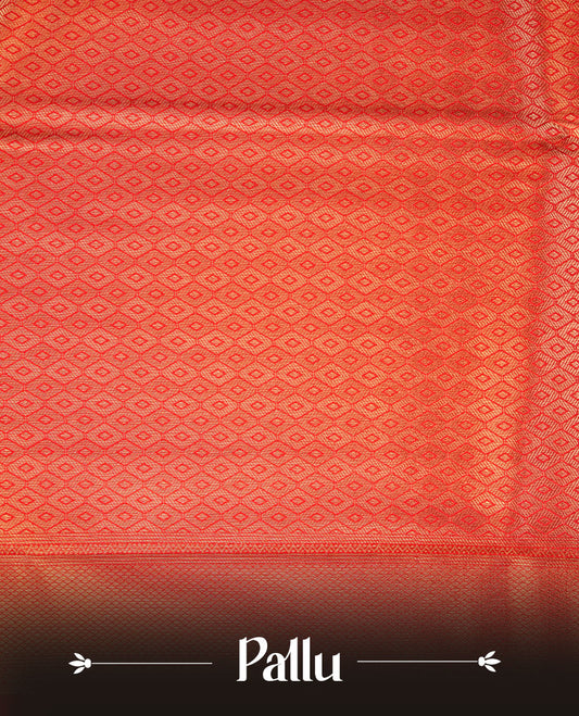 Red colour semi soft silk brocade saree featuring elegant self-woven floral motifs across the body, highlighted with a richly detailed self-colour border and pallu, paired with a matching blouse.