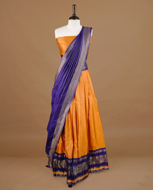 Mustard colour semi stitched Half saree featuring contrast navy blue colour with gold zari traditional border skirt, paired with matching zari border dupatta, unstitched blouse piece