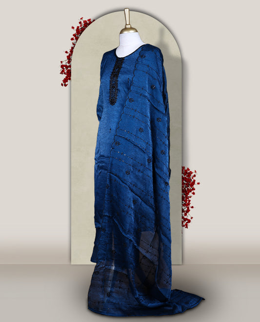 Blue churidar set adorned with intricate black cut bead work on the neckline, paired with a matching bottom & The set comes with a lightweight embroidered dupatta, adding elegance and charm to your ethnic look.