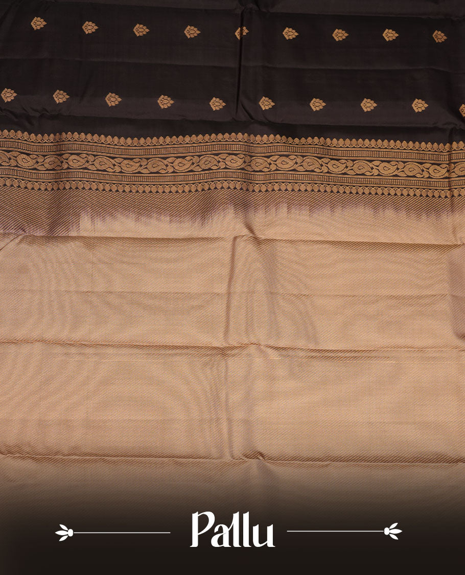 Black colour vasundhara silk saree featuring gold zari buttas on body, complemented by contrast chikku with zari border, paired with  matching blouse piece.