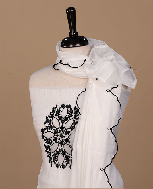 White colour churidari material featuring black thread pattern on body, paired with matching bottom and dupatta