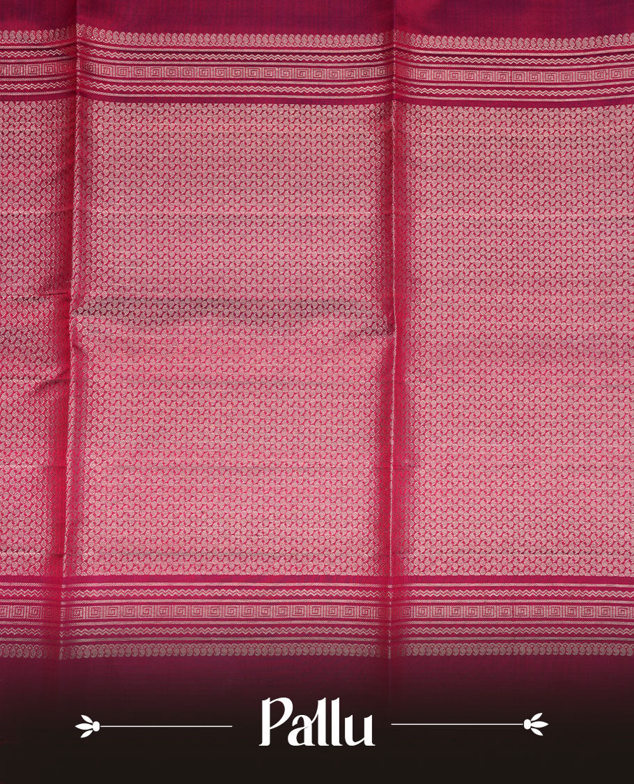 Burgundy colour soft silk saree featuring gold zari motifs on body, complemented by self colour with traditional border with tassel at pallu, paired with matching blouse piece.