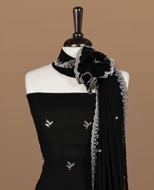 Black colour churidhar material featuring gold thread floral pattern on body, paired with matching bottom & dupatta.