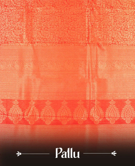 Red colour semi silk brocade saree featuring intricate Gold patterns across the body, complemented by a Self colour woven border and pallu, paired with a matching blouse.