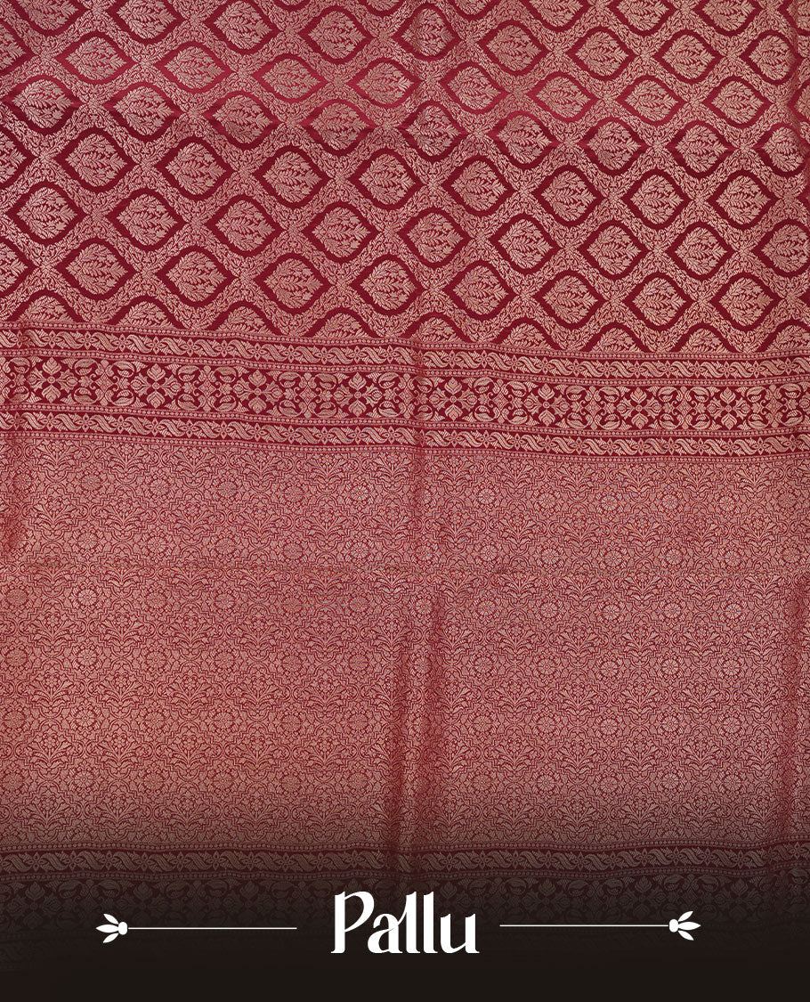 Chocolate brown colour banaras satin crepe saree featuring gold zari pattern across body, with self colour border with gold zari pattern and paired with matching blouse.