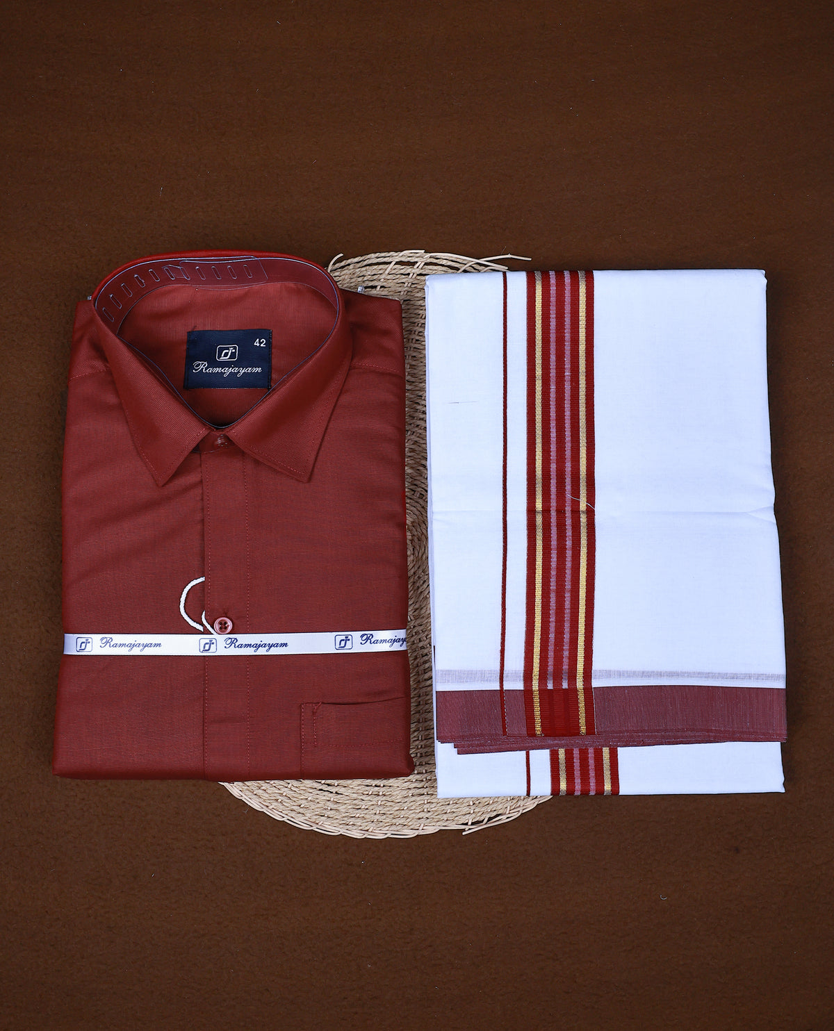 Maroon  colour RAMAJAYAM shirt paired with a matching dhoti, finishing with a maroon kara