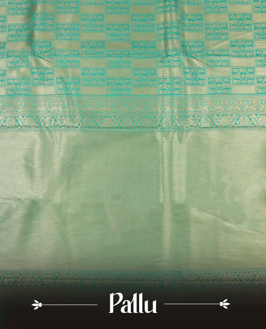 Aqua Blue colour semi silk brocade saree featuring intricate Gold Square patterns across the body, complemented by a Self colour woven border and pallu, paired with a matching blouse.