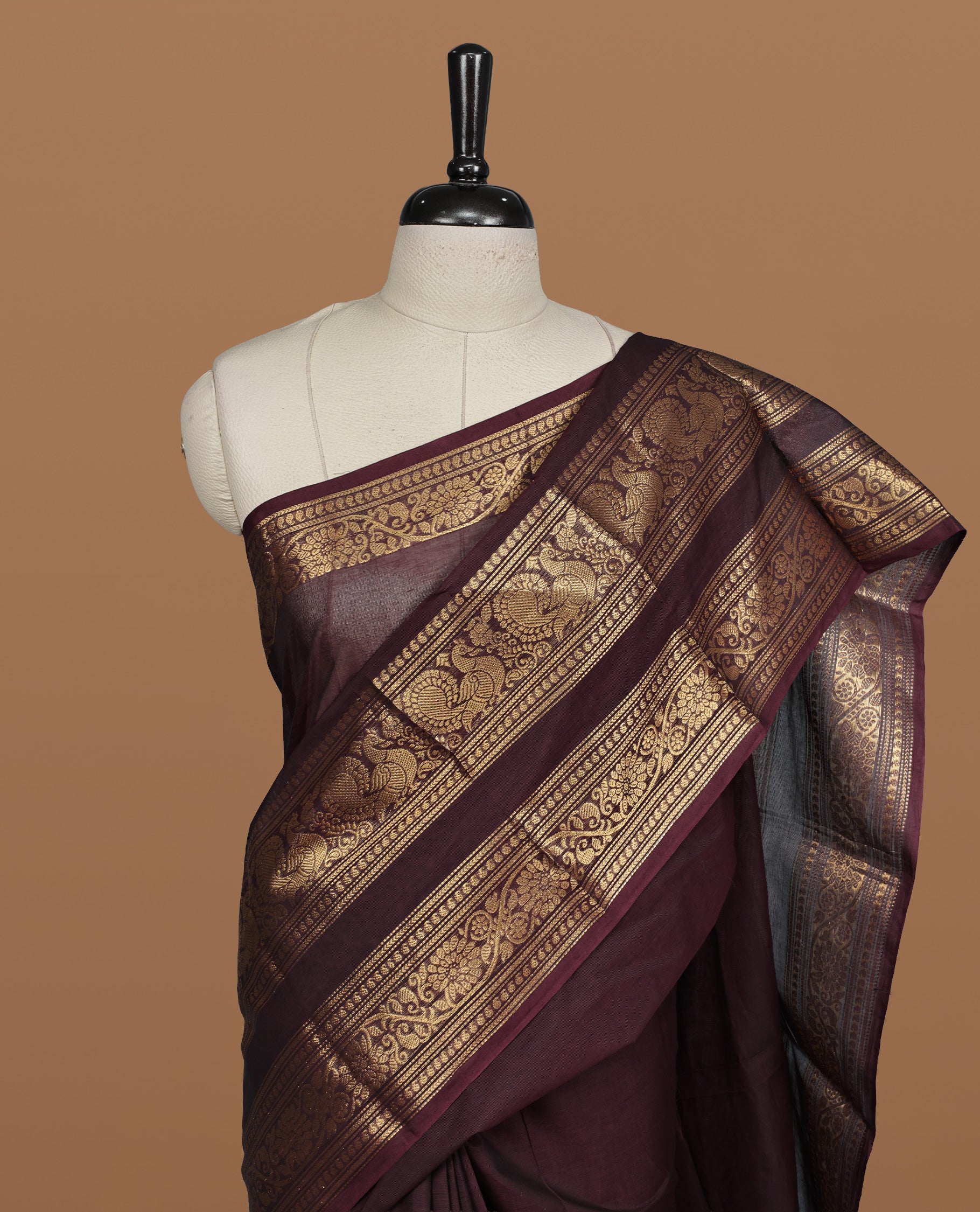 Chocolate Brown colour Chettinad cotton saree featuring Elegant plain body , complemented by self colour with zari border, comes with matching blouse piece.