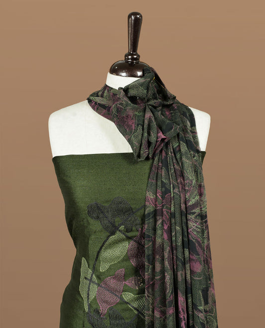 Dark green colour churidar material featuring thread & sequins Worked pattern on body, comes with matching bottom and dupatta.