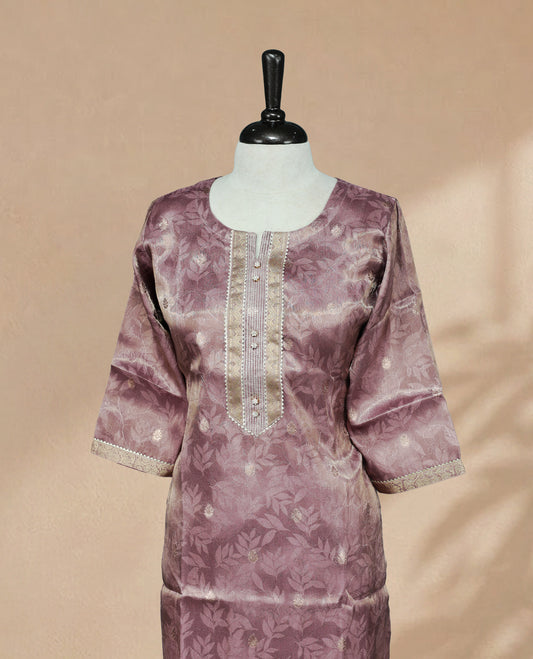 Lavender colour Kurti featuring an intricate floral pattern, a  U-shaped neckline adorned with detailed Stone & thread work, and 3/4 sleeves Design
