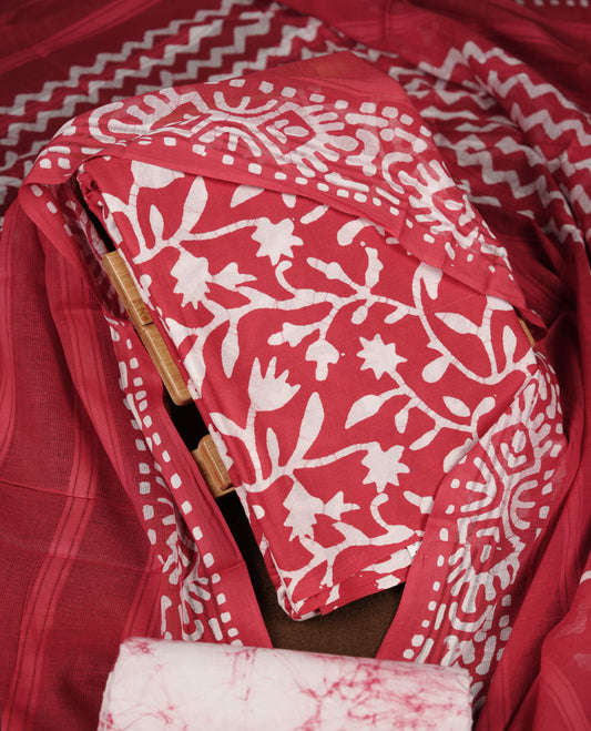 Red colour churidar material featuring white floral printed body, paired with a matching chevron printed dupatta.