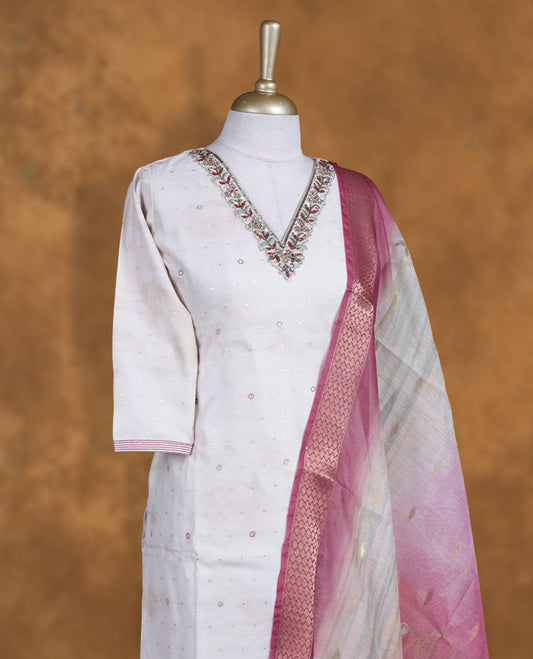 Ivory colour churidar set featuring thread and embroidered  pattern neckline, sleeves, and thread embroidery motifs on body , Paired with a matching dupatta