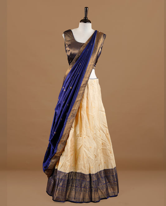 Gold and blue colour Half saree featuring gold colour skirt with contrast blue colour border with gold zari pattern, paired with matching dupatta and stitched blouse piece.