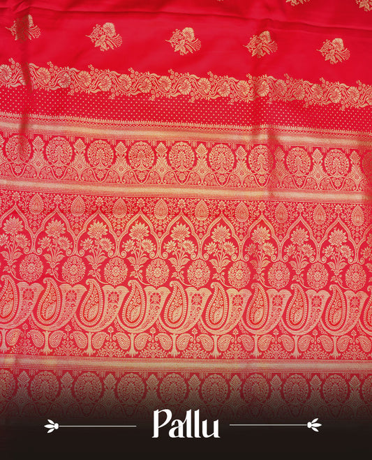 Red colour Banaras Satin Crepe saree featuring gold zari floral motifs on the body, a richly detailed traditional border with intricate gold zari work, and paired with a matching blouse.