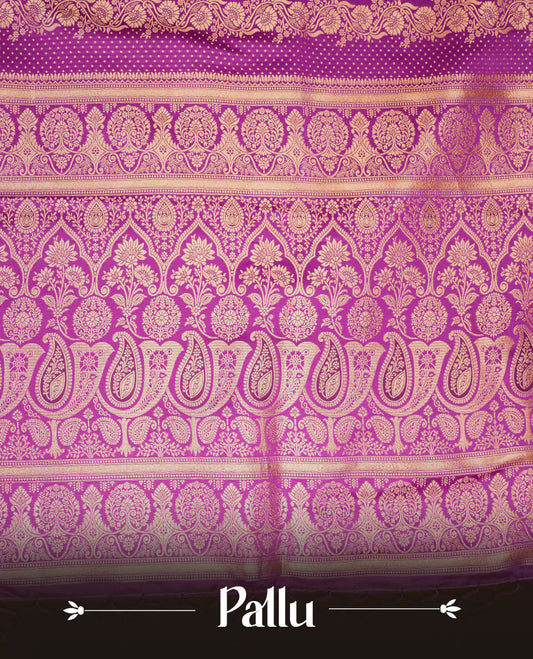 Grape purple  colour Banaras Satin Crepe saree featuring gold zari floral motifs on the body, a richly woven traditional border with intricate gold zari detailing, and paired with a matching blouse. (Copy)