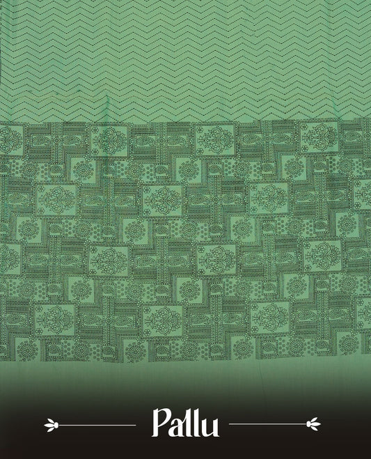 Pista Green colour poly cotton saree with black zigzag line pattern on the body, paired with a matching pallu featuring black chevron lines and panelled floral‑paisley design, and a coordinated all‑over floral paisley patch‑style printed blouse piece.