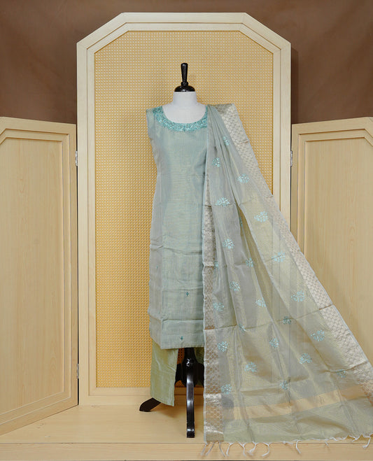 Goldish Pastel Green colour Tissue Churidar set featuring delicate floral embroidery on the round neckline, paired with matching solid pants and dupatta