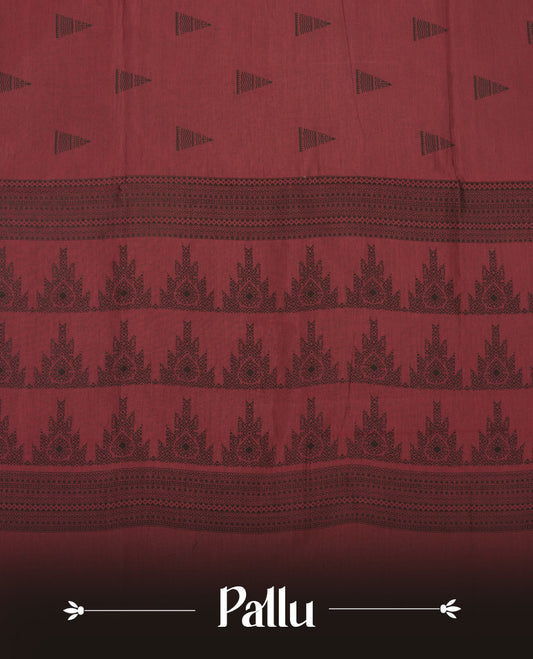 Dark red colour poly cotton saree with black temple motifs on the body, paired with a matching with black woven traditional border, and a coordinated all‑over geometric printed blouse piece.