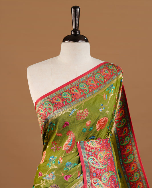Olive Green colour Pashmina Saree featuring elegant floral and paisley woven motifs, enhanced with a contrast pink woven border and a richly detailed traditional pallu, paired with a matching blouse piece.